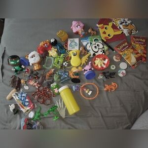 Assorted Colorful Knick Knack, Figurine And Pokemon Cards Toy Set